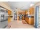 Kitchen with wood cabinets, stainless steel appliances, and granite countertops at 30735 Lanesborough Cir, Wesley Chapel, FL 33543
