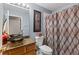 Clean bathroom with a shower/tub combo and updated vanity at 30735 Lanesborough Cir, Wesley Chapel, FL 33543