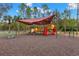 playground with shade structure and safe surface at 30735 Lanesborough Cir, Wesley Chapel, FL 33543