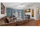 Spacious living room with pool view and comfortable seating at 30735 Lanesborough Cir, Wesley Chapel, FL 33543