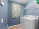 Convenient laundry room with washer and dryer at 30735 Lanesborough Cir, Wesley Chapel, FL 33543