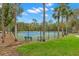 Two well-maintained tennis courts with surrounding fence at 30735 Lanesborough Cir, Wesley Chapel, FL 33543