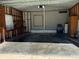 Attached garage with workbench and storage area at 34303 Lodge Dr, Wesley Chapel, FL 33543
