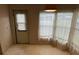 Dining area with large window and patterned wallpaper at 34303 Lodge Dr, Wesley Chapel, FL 33543
