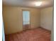 Simple bedroom with carpeted floor and window at 34303 Lodge Dr, Wesley Chapel, FL 33543