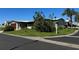 Single-wide manufactured home with corner lot and mature landscaping at 34303 Lodge Dr, Wesley Chapel, FL 33543