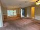 Spacious living room with light pink carpeting at 34303 Lodge Dr, Wesley Chapel, FL 33543