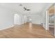 Open living room with hardwood flooring and views to the backyard and kitchen at 18051 Java Isle Dr, Tampa, FL 33647