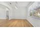 Spacious dining area with hardwood floors and a large window at 18051 Java Isle Dr, Tampa, FL 33647