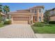 Two-story house with a two-car garage at 18051 Java Isle Dr, Tampa, FL 33647
