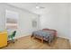 Bedroom with light wood flooring, window, and a bed at 18051 Java Isle Dr, Tampa, FL 33647