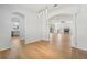 Open concept dining room featuring hardwood floors and views into living room and kitchen at 18051 Java Isle Dr, Tampa, FL 33647