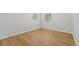 Simple bedroom with light wood flooring at 18051 Java Isle Dr, Tampa, FL 33647