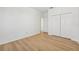 Charming bedroom with wood flooring and access to another room at 18051 Java Isle Dr, Tampa, FL 33647