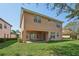 Two-story house with a large backyard and covered patio at 18051 Java Isle Dr, Tampa, FL 33647