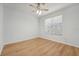 Spacious bedroom with light walls, wood flooring, and a ceiling fan at 18051 Java Isle Dr, Tampa, FL 33647