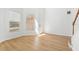 Sunlit living room featuring wood floors and a view to the backyard at 18051 Java Isle Dr, Tampa, FL 33647