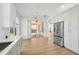Modern kitchen with white cabinets, stainless steel appliances and quartz countertops at 18051 Java Isle Dr, Tampa, FL 33647
