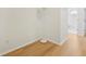Light hallway with wood-look flooring and a view of the bathroom at 18051 Java Isle Dr, Tampa, FL 33647