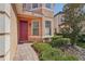 Front entrance with a red door and landscaping at 18051 Java Isle Dr, Tampa, FL 33647