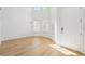 Spacious living room with light wood floors and large windows at 18051 Java Isle Dr, Tampa, FL 33647