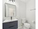 Modern bathroom with updated vanity, toilet, and patterned floor at 18051 Java Isle Dr, Tampa, FL 33647