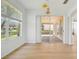 Spacious dining area with sliding doors to patio and lake view at 18051 Java Isle Dr, Tampa, FL 33647