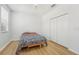 Bright bedroom with double doors leading to the closet and a window with blinds at 18051 Java Isle Dr, Tampa, FL 33647