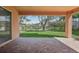 Brick patio overlooking a canal with houses and lush greenery at 18051 Java Isle Dr, Tampa, FL 33647