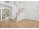 Bright entryway with staircase, wood floors, and views to the backyard at 18051 Java Isle Dr, Tampa, FL 33647