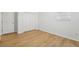 Spacious bedroom with wood flooring and double door closet at 18051 Java Isle Dr, Tampa, FL 33647