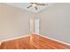 Well-lit bedroom with wood floors and ceiling fan at 16315 Sambourne Ln, Tampa, FL 33647