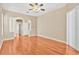 Spacious living room with hardwood floors and an archway leading to another room at 16315 Sambourne Ln, Tampa, FL 33647