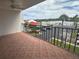 Balcony showcasing views of the waterfront and adjacent parking lot for a relaxing outdoor space at 19111 Vista Bay Dr # 308, Indian Shores, FL 33785