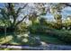 Mature trees and garden path at 2406 S Clark Ave, Tampa, FL 33629