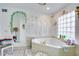 Relaxing bathroom with corner jacuzzi tub and painted mural at 2406 S Clark Ave, Tampa, FL 33629