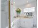Clean bathroom with double vanity and marble countertop at 2406 S Clark Ave, Tampa, FL 33629