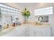 Modern bathroom with double vanity and marble countertop at 2406 S Clark Ave, Tampa, FL 33629