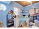 Small bedroom with light blue walls and a double bed at 2406 S Clark Ave, Tampa, FL 33629