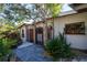 Inviting home exterior with a charming gate and walkway at 2406 S Clark Ave, Tampa, FL 33629
