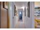 Long hallway with light walls and tile floors at 2406 S Clark Ave, Tampa, FL 33629