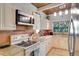 Kitchen features granite countertops and stainless steel appliances at 2406 S Clark Ave, Tampa, FL 33629