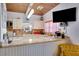 Well-equipped kitchen with granite counters and wood cabinets at 2406 S Clark Ave, Tampa, FL 33629