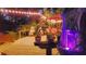 Night view of backyard deck, fountain, and string lights at 2406 S Clark Ave, Tampa, FL 33629