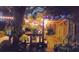 Night view of backyard deck with string lights and pergola at 2406 S Clark Ave, Tampa, FL 33629