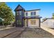 Two-story modern farmhouse with black and white exterior, under construction at 476 43Rd N Ave, St Petersburg, FL 33703