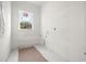 Unfinished laundry room with window and tile flooring at 476 43Rd N Ave, St Petersburg, FL 33703