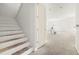 Open staircase leading to upper level with unfinished wood steps at 476 43Rd N Ave, St Petersburg, FL 33703