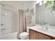 Bathroom with tub, shower, and wood vanity at 5648 Sunset Falls Dr, Apollo Beach, FL 33572