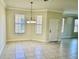 Bright dining room with tile floors and chandelier at 5648 Sunset Falls Dr, Apollo Beach, FL 33572